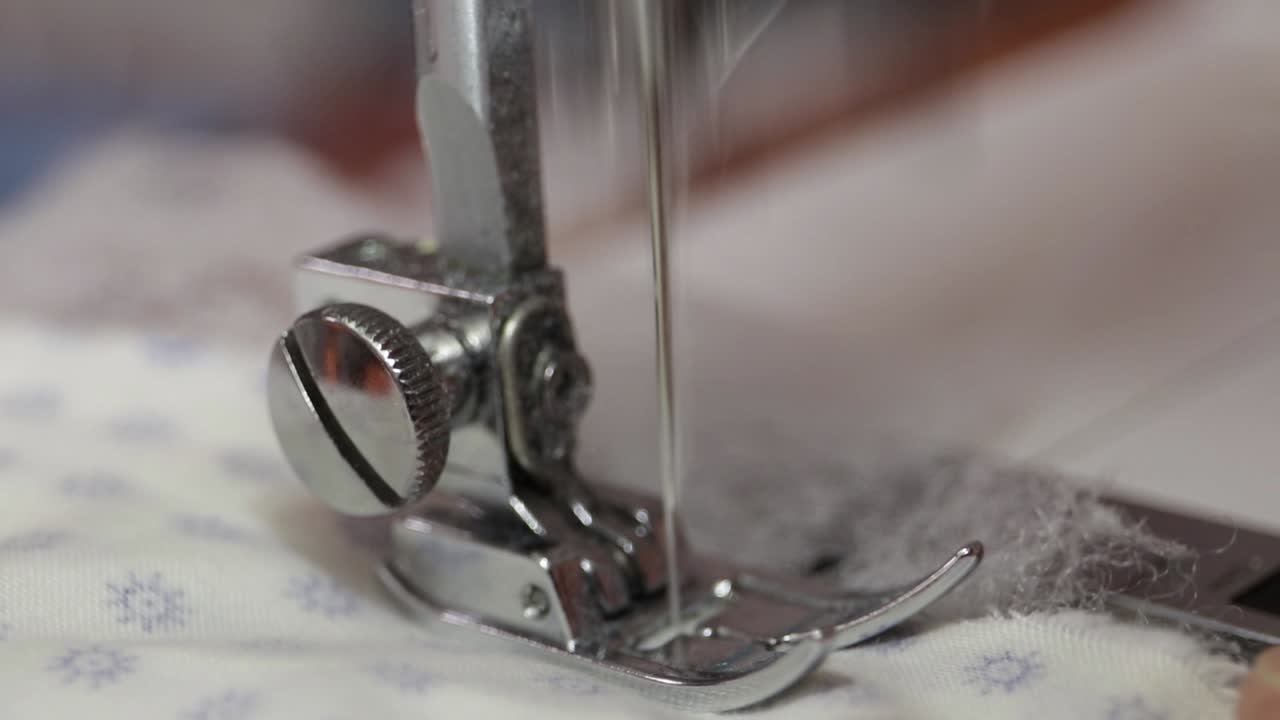 Sewing machine at work for production of covid-19 protective masks