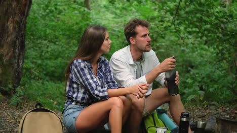 couple discussing in a forest