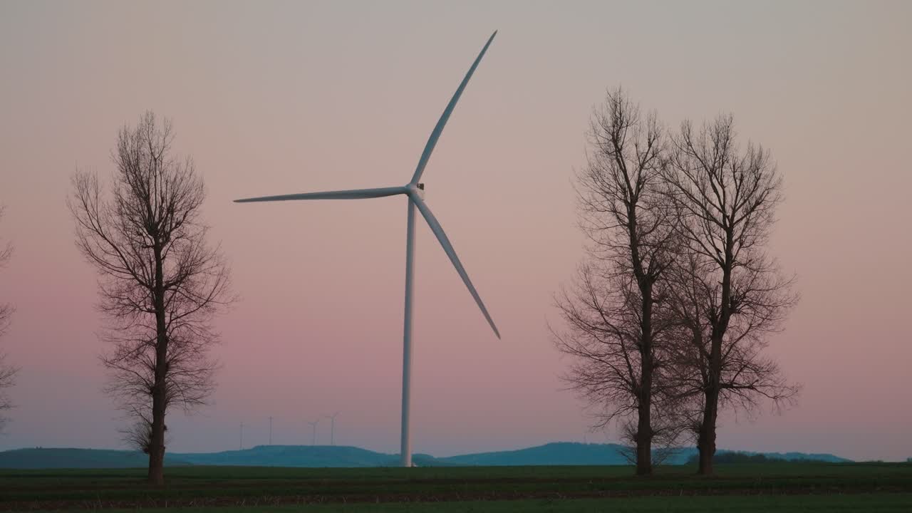 Wind Turbine in a Field at Sunset