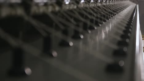 Macro-Shot-Of-Cotton-Thread-Being-Spun-On-A-Spinning-Machine