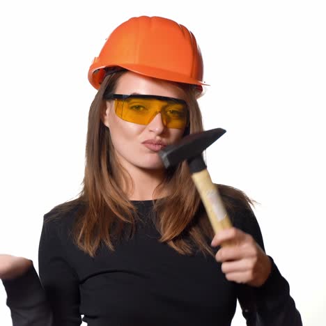 young smiling worker woman. isolated over white background. construction and maintenance.