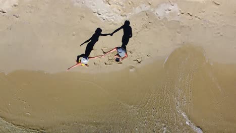happy romantic couple enjoying and dancing in the summer vacations on the beach