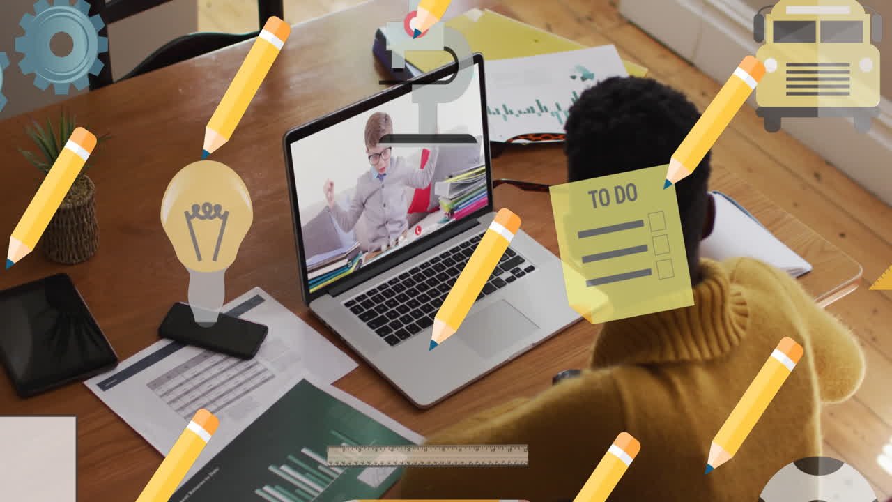 animación de iconos escolares sobre una maestra afroamericana y un escolar en una lección en línea en una computadora portátil