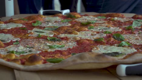 giant margarita pizza and pizza cutter