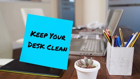 Animation-of-keep-your-desk-clean-note-over-office-items-and-laptops-on-desk