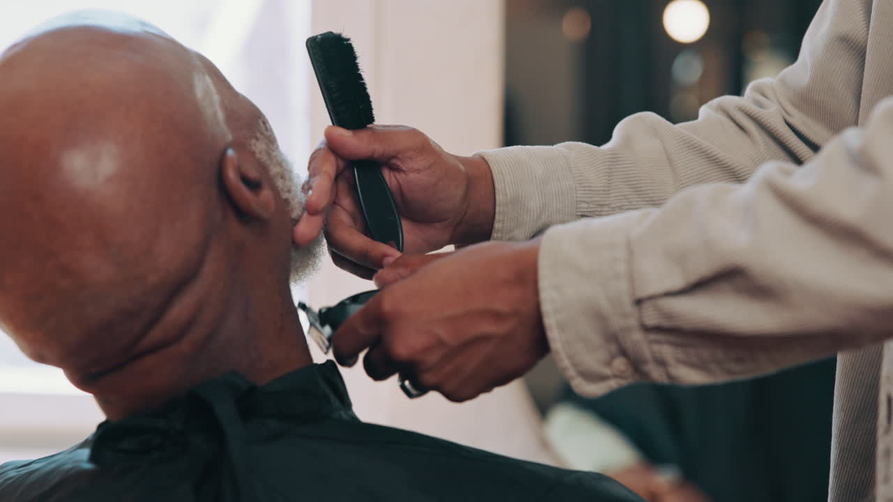 Barber Trimming a Man's Beard with Clippers in a Barbershop