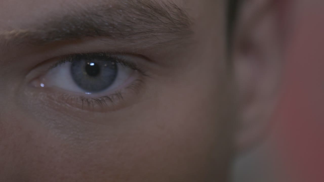 Close Up Of A Man With Blue Eye, Looking At The Camera. - close up shot