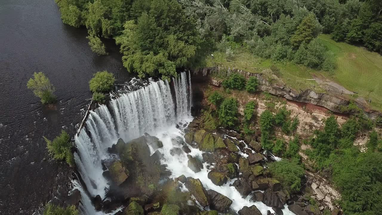 Laya Waterfalls, Chile. Dynamic Drone Aerial View of River Falls and Green Landscape Above Canyon