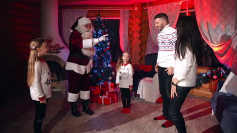 happy family with santa claus. big happy family spending christmas day all together with santa claus at home