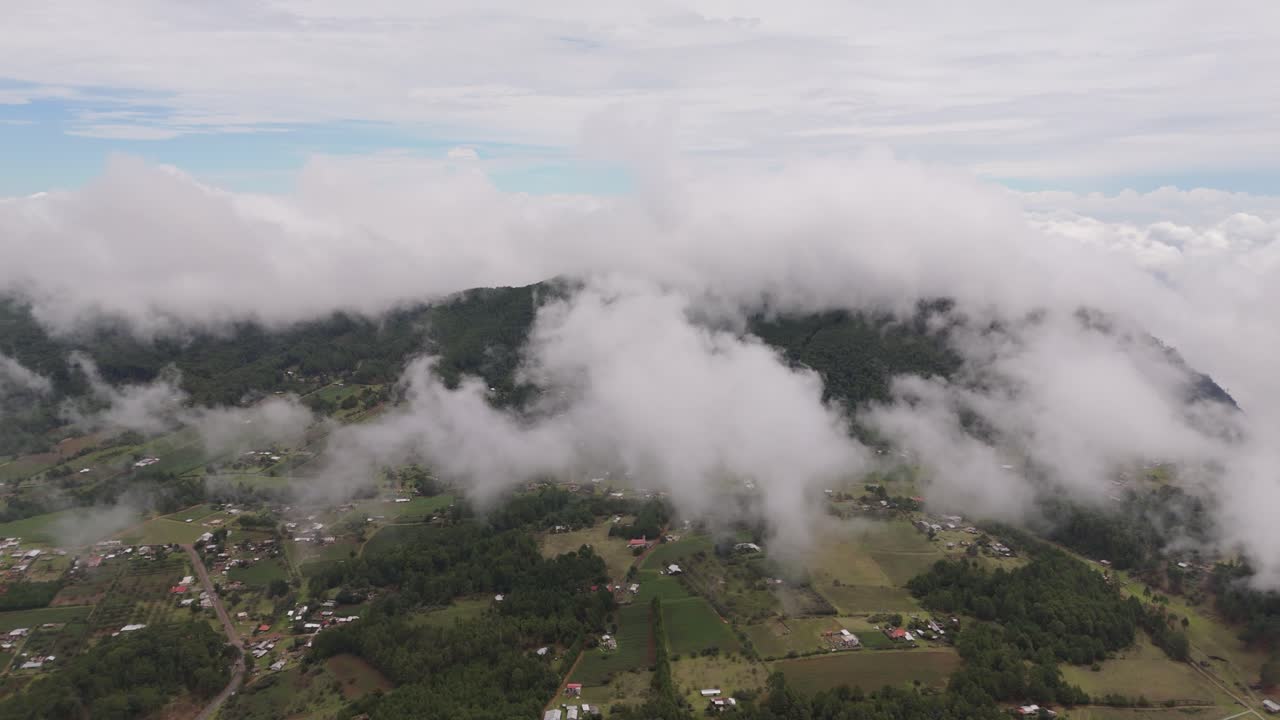Discover breathtaking views of villages nestled between clouds from a drone’s eye.