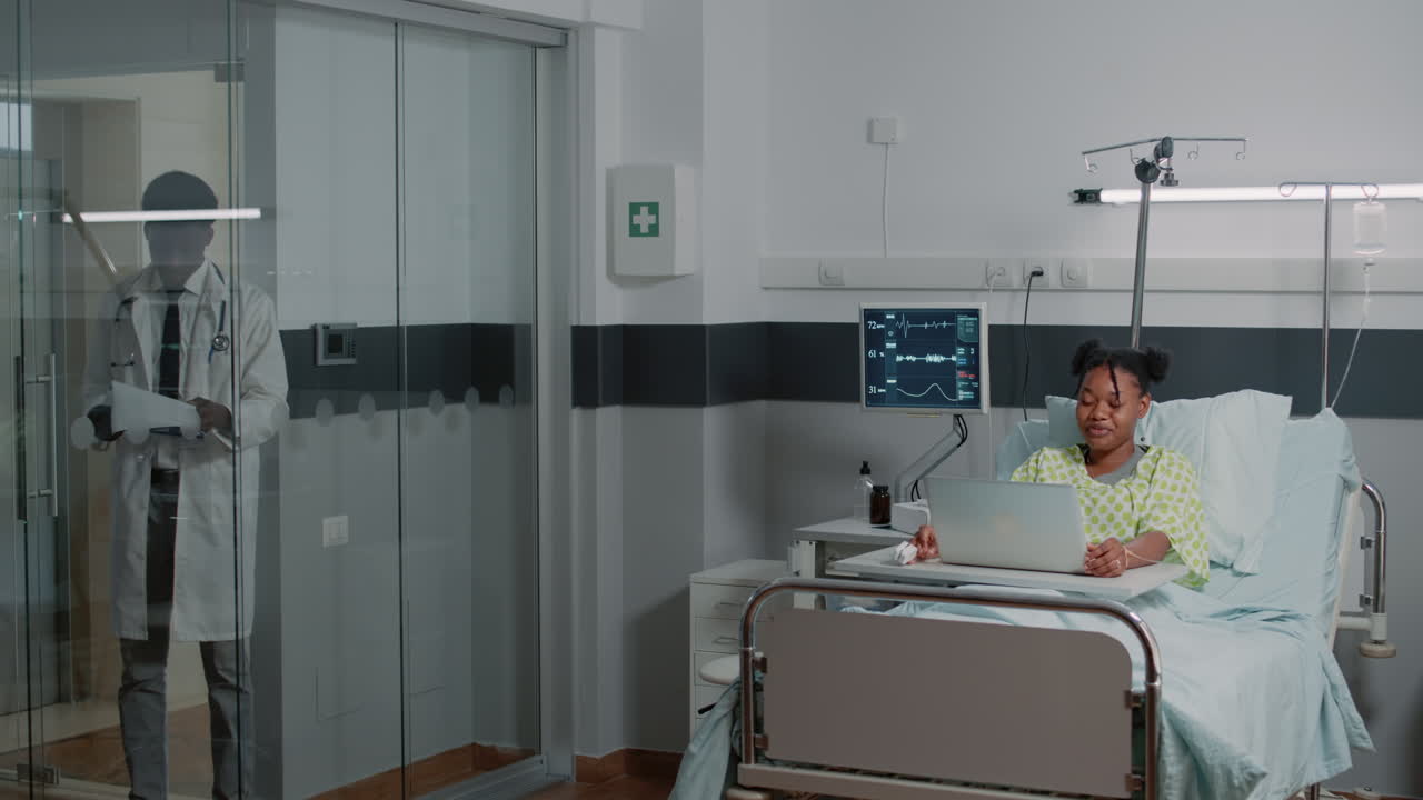 Young patient using video call on laptop for remote communication