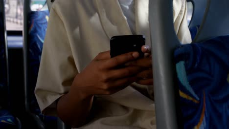 Female-commuter-using-mobile-phone-while-travelling-in-bus-4k