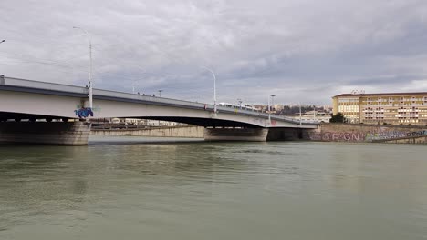 tramway crossing lyon's bridge over the flowing river, offering a scenic journey through the heart of france