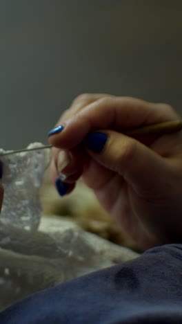 hands knitting on knitting needles