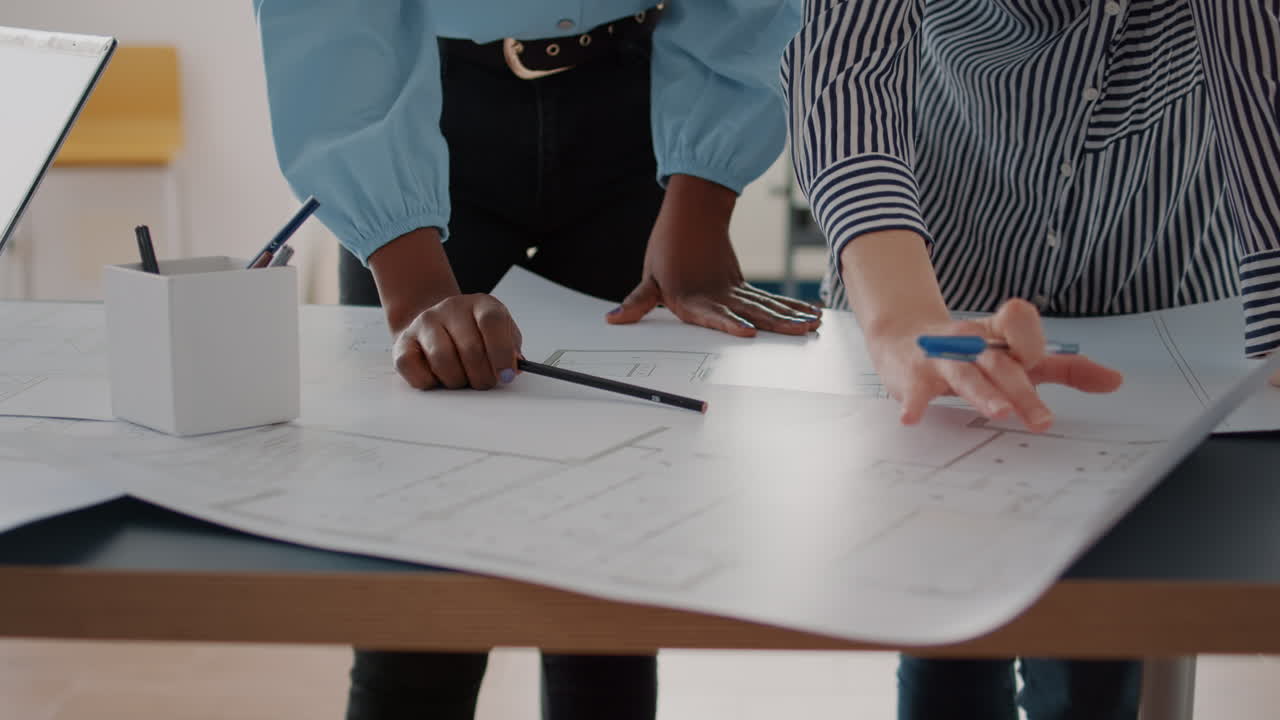 Team Collaborating on Architectural Blueprints