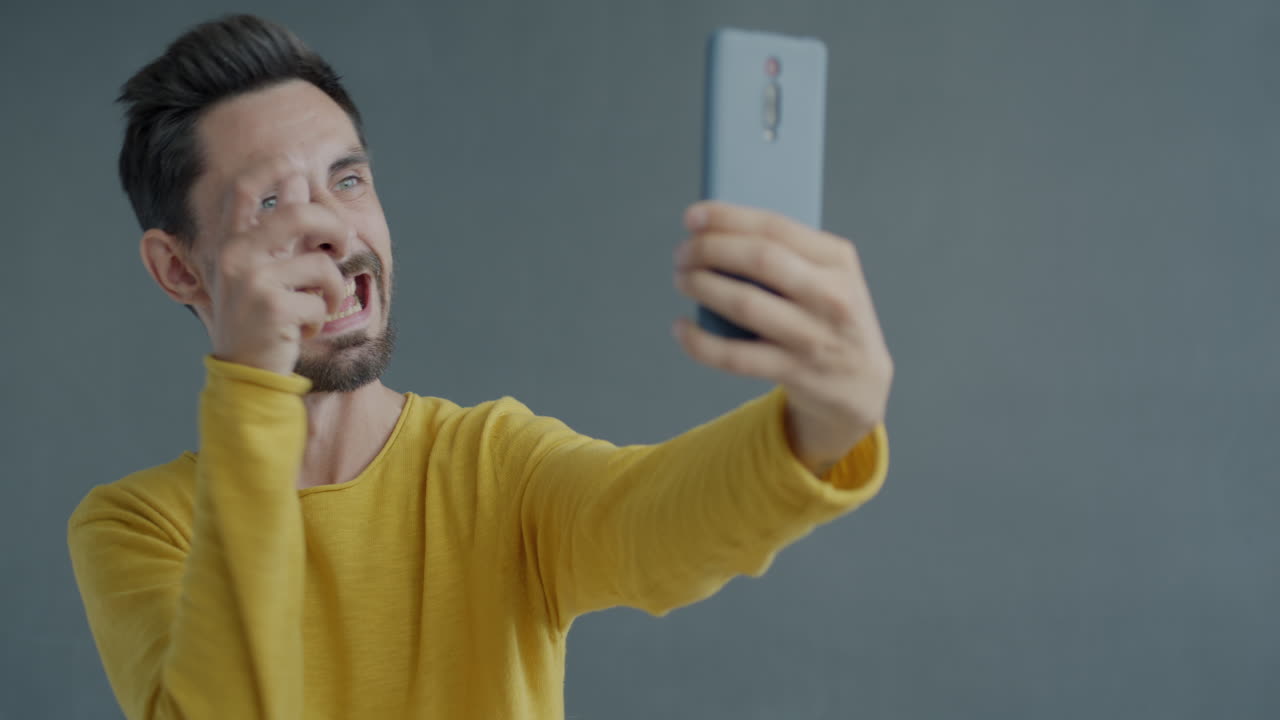 Man making funny selfies
