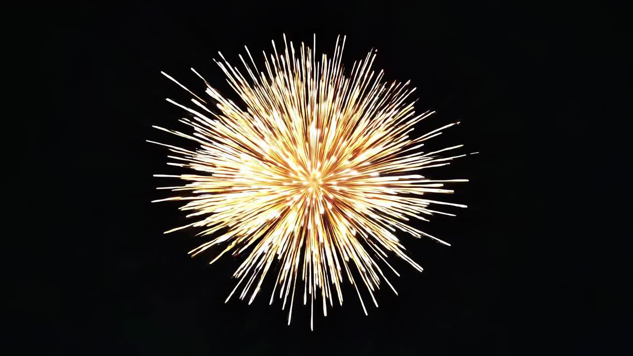 A mesmerizing burst of fireworks captured from a low-angle shot, creating a dynamic, explosive