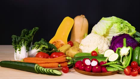 assorted vegetables arranged on a black background