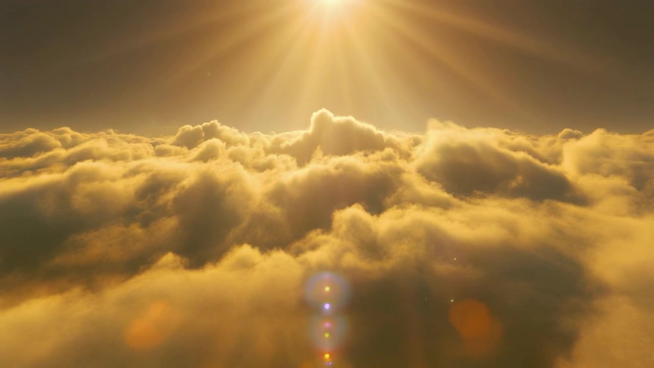 Aerial View of Golden Clouds at Sunset with Sun Rays