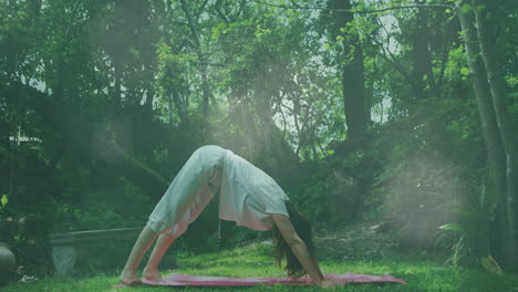 animation of light spots over caucasian woman practicing yoga in garden
