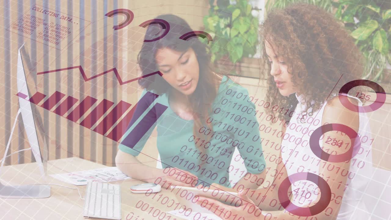 Two women at desk, right tapping tablet and causing business charts, binary stream for decisions