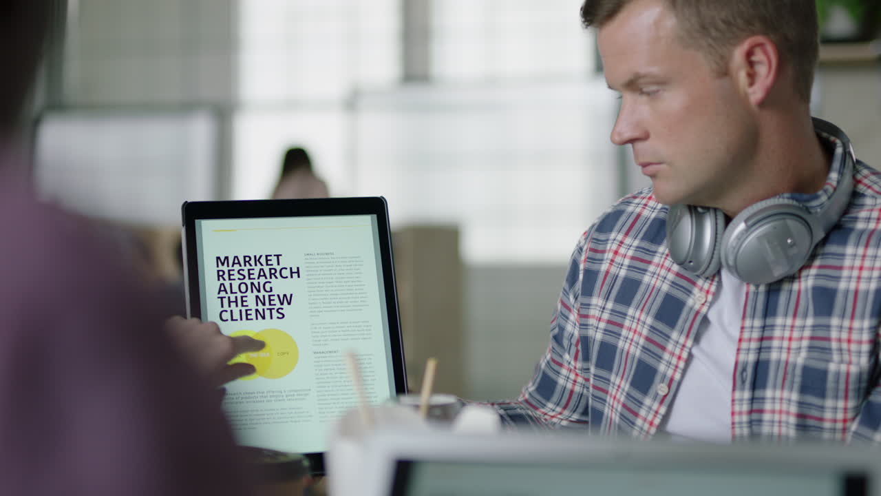 professional business people meeting caucasian businessman using tablet computer sharing financial research data showing marketing team graph statistics on screen in office presentation