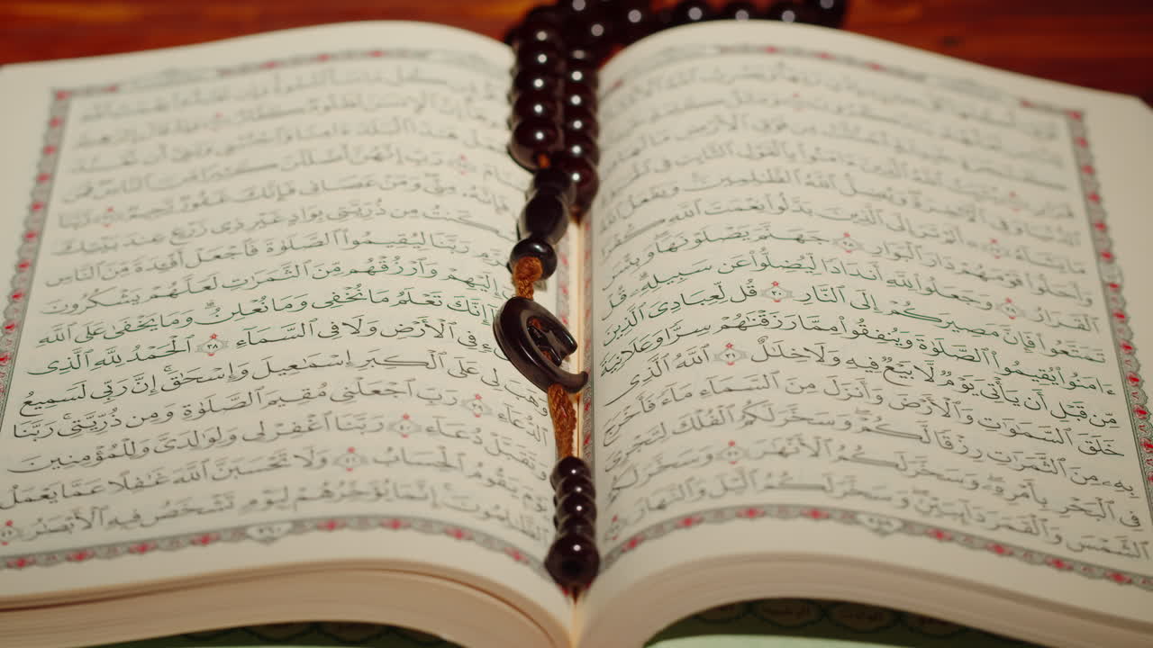 Quran book close-up, praying, islamic religion. Religious holiday Ramadan, holy month. Worship, making traditional prayer to God
