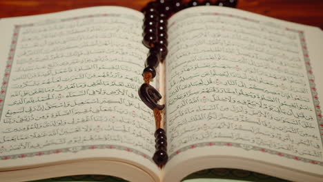 quran book close-up, praying, islamic religion. religious holiday ramadan, holy month. worship, making traditional prayer to god