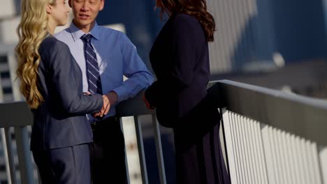 multi ethnic management team meeting on chicago rooftop