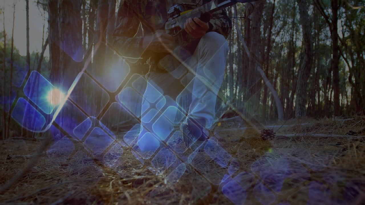 Hunter with rifle in forest over abstract geometric light pattern animation
