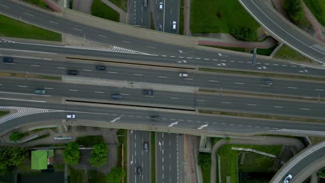 Major-expressway-junction,-people-commuting-onwards,-road-network,-aerial