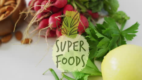 super foods text animation over fresh vegetables including radishes and parsley