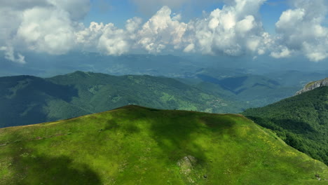 flight over green mountain peaks