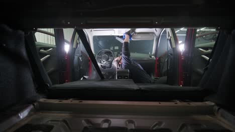 professional car cleaning. сar wash. interior detailing. dry clean and detail a car interior. deep cleaning of the car body and seats. wiping foam in car wash. cleaning the car panel from dust. a vacuum cleaner