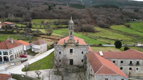 aerial pullback from santa maria de xunqueira monastery bell tower