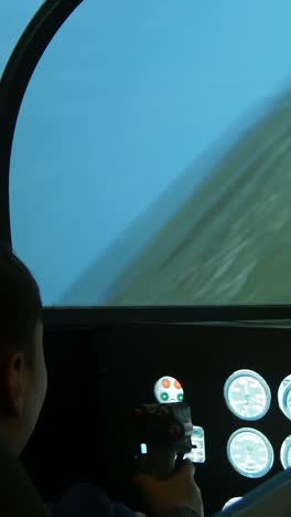 child in a flight simulator
