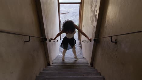 female dancer in an empty warehouse