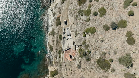 incredible aerial of house built on coast cliff in catalonia, cap de creus