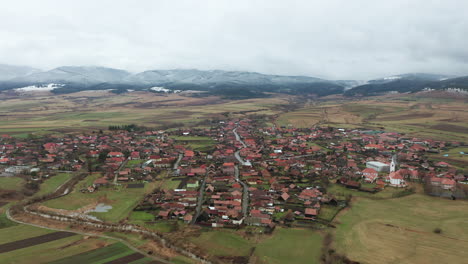 Flyover-above-homes,-buildings-of-Sancraieni,-Romania