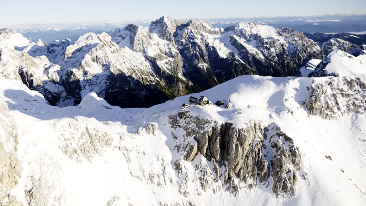 Snowy Alpine Peaks with Mountain Hut