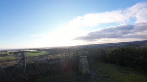 fpv drone flying across billinge hill beacon viewpoint and autumn lancashire farmland landscape