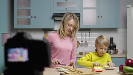 kids and mom making sandwiches