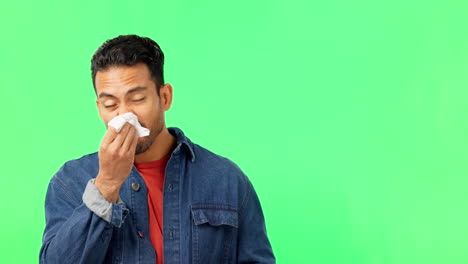 man sneezing, blowing nose on green screen