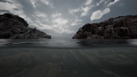 Medio-Bajo-El-Agua-En-El-Mar-Del-Norte-Con-Rocas