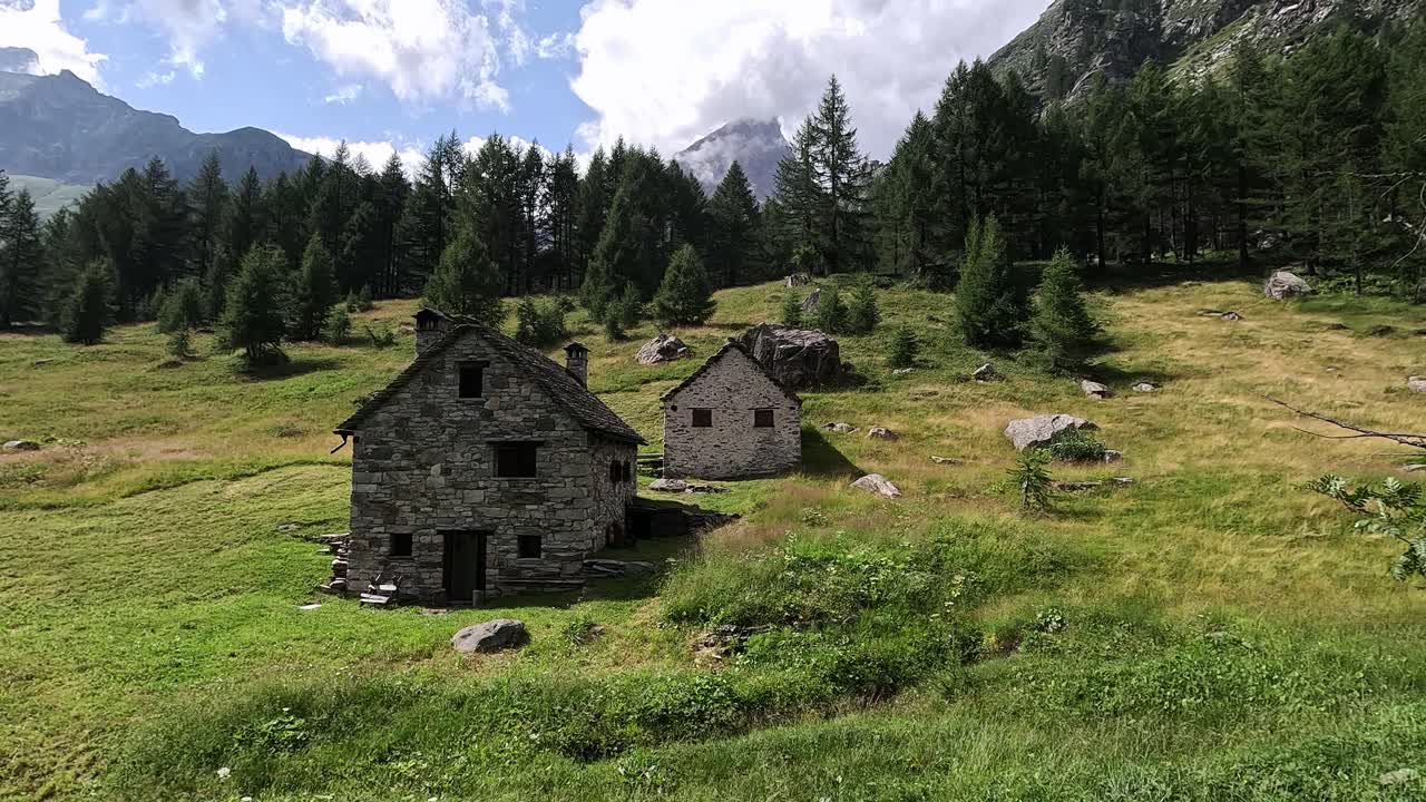 Old Stone Cabins in the Alpine Meadows of Cantone on the Grande Traversata delle Alpi, Verbano-Cusio-Ossola, Italian Alps