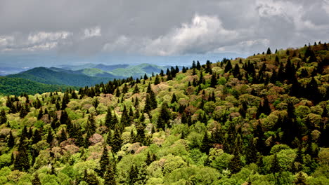 atmospheric flyover of smoky mountains with heavy mist and gentle rainfall