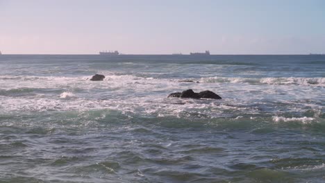 two large tankers in the indian ocean off north beach in durban, south africa