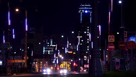 city street at night with colorful lights