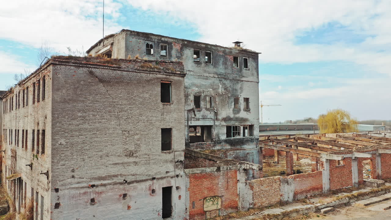 Abandoned building. Aerial view of an old factory ruin and broken windows.