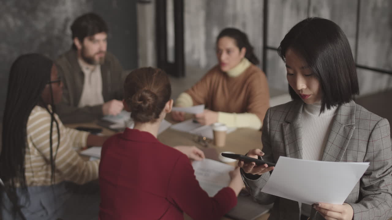 Businesswoman Talking on Cellphone and Posing